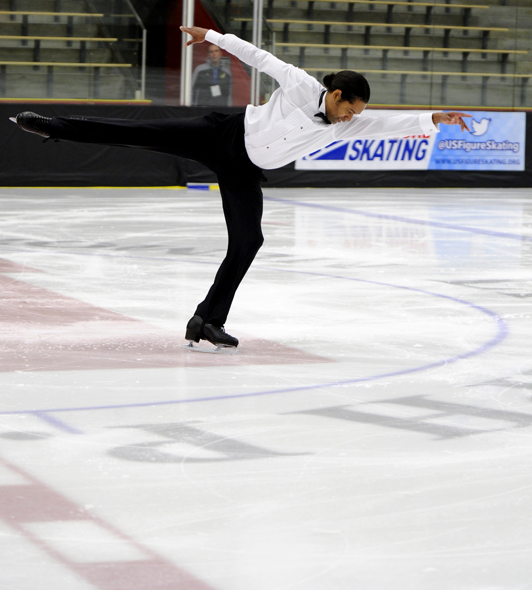 Larry Holliday, in a white shirt and black pants 