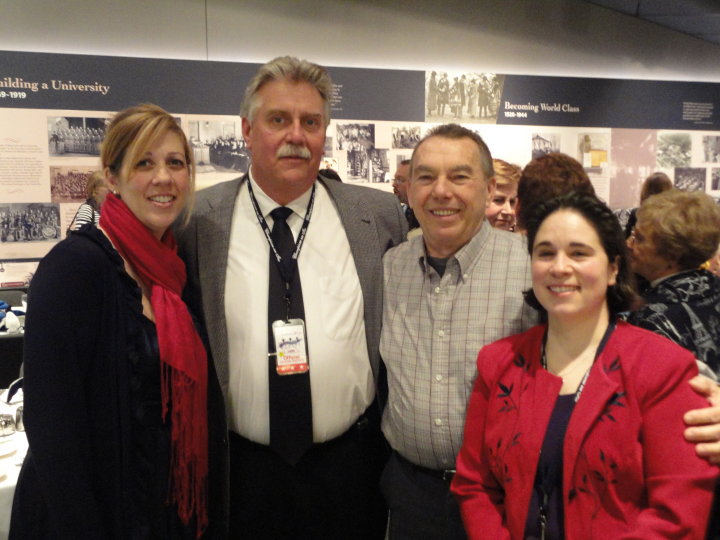 announcers at synchro championships pose together