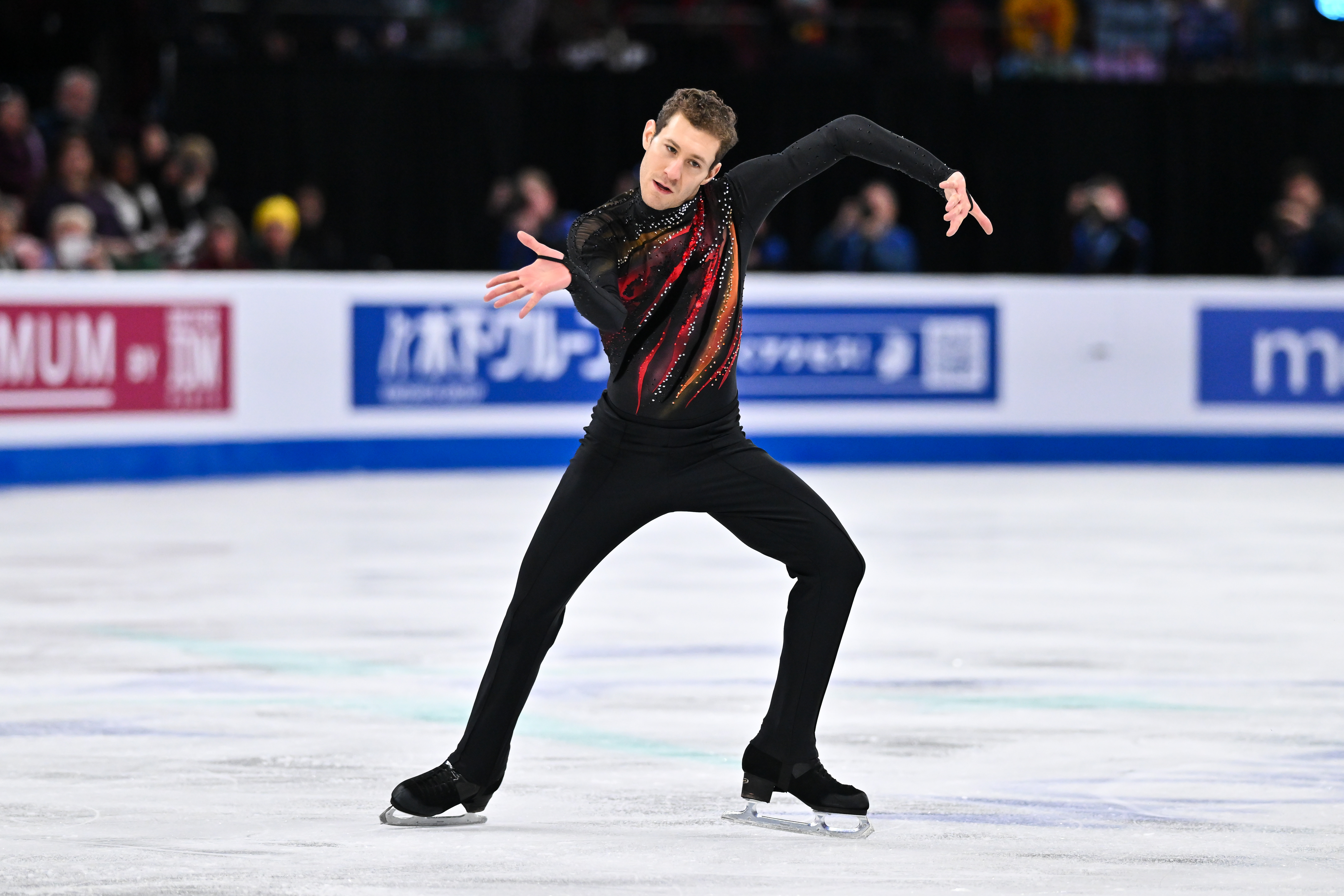 Jason Brown twists his arms, hands and head to create an illusion on the ice.