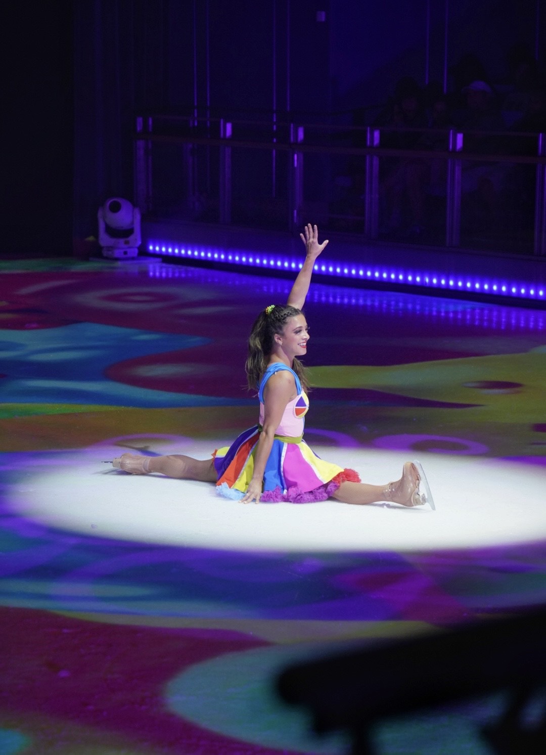 Jordan Bauth, dressed in rainbow colors, finishes with the splits on the floor.