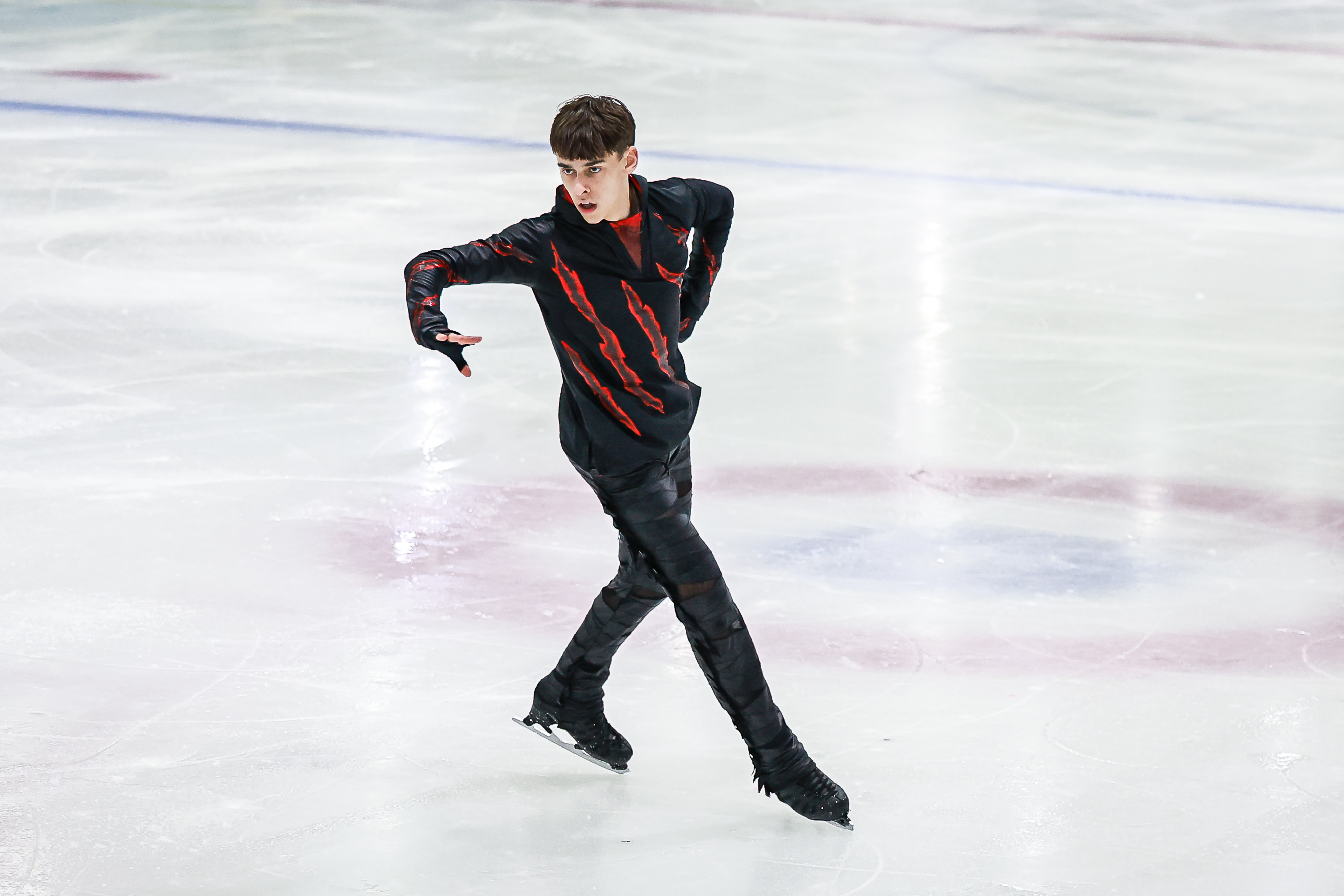 Wearing black with red highlights on his pants, Patrick Blackwell performs at JGP Thailand.