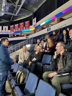Coaches sit in an information session at 2023 Humans Skate America