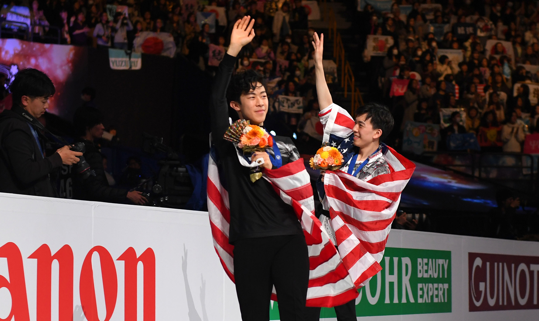 Nathan Chen and Vincent Zhou celebrate their medals at the 2019 World Championships